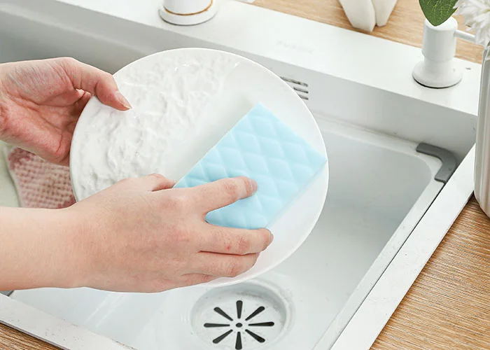 scrubbing dishes